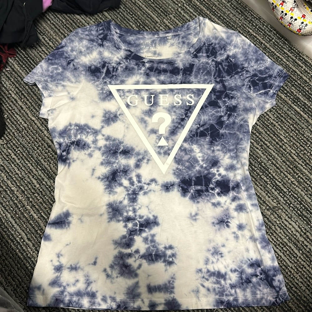 A Guess shirt it’s a Large